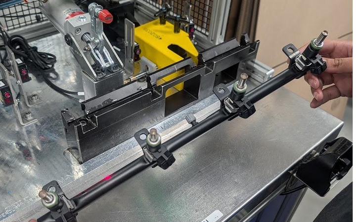 Fuel rail assembly under dimensional inspection