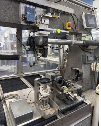 Laser welding cell with a part fixtured under the head